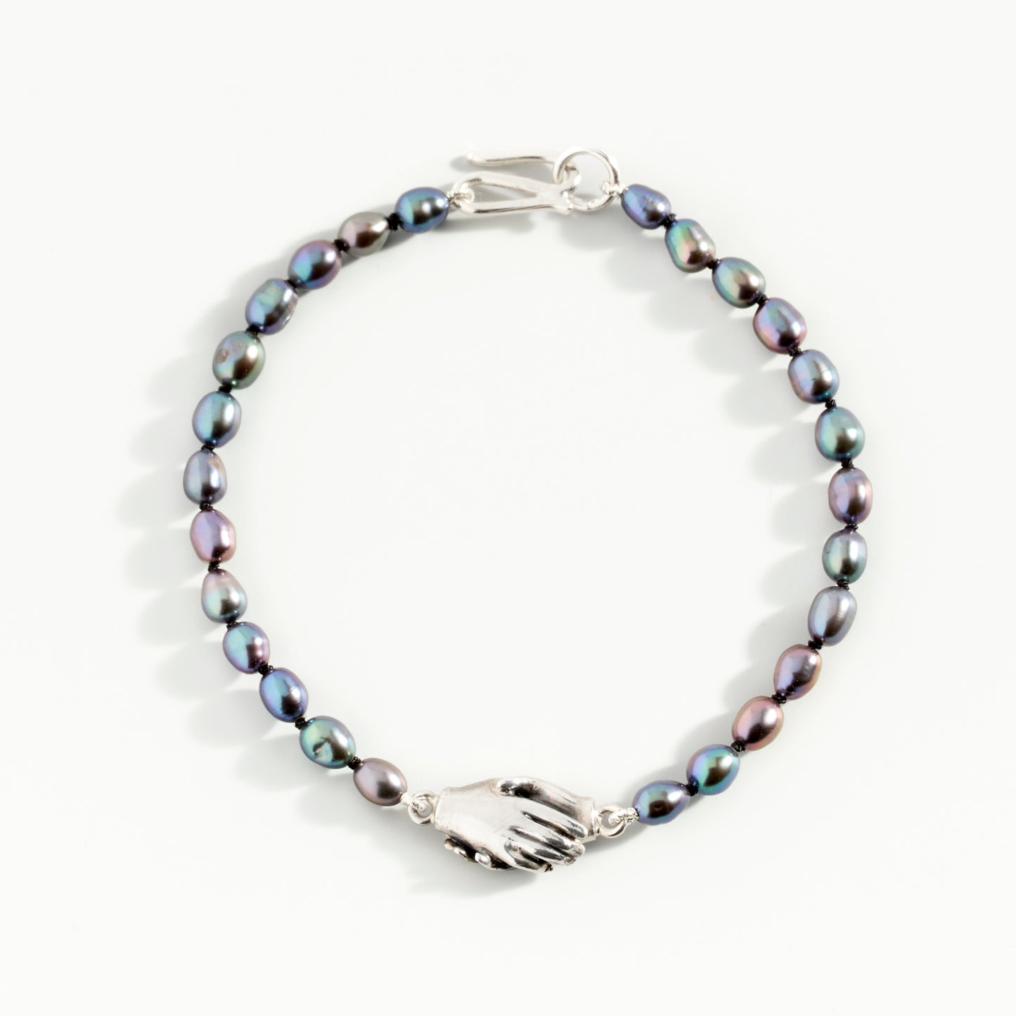 Clasped Hands Peacock Pearl Bracelet by Emma White