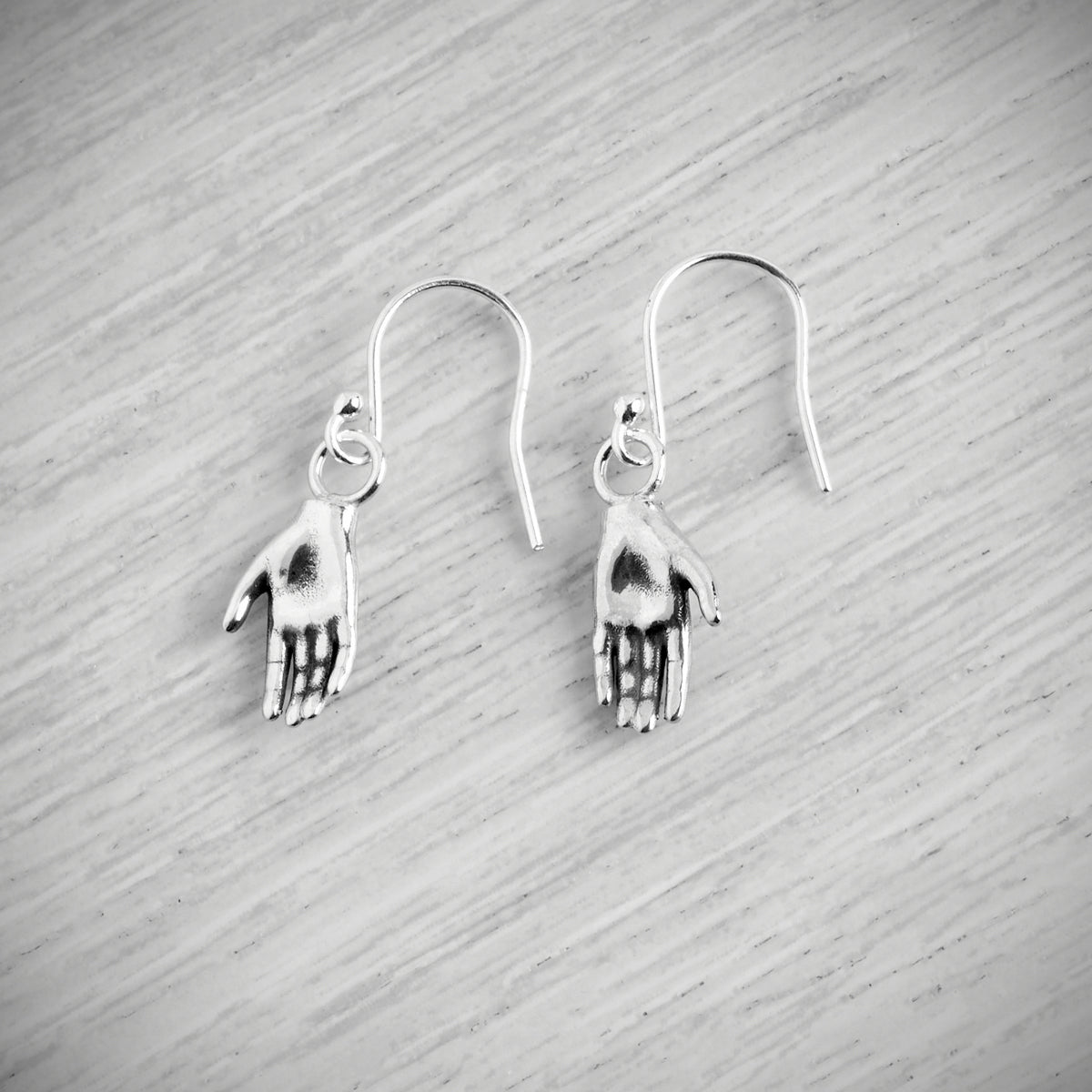 Tiny Hand Hook Earrings by Emma White