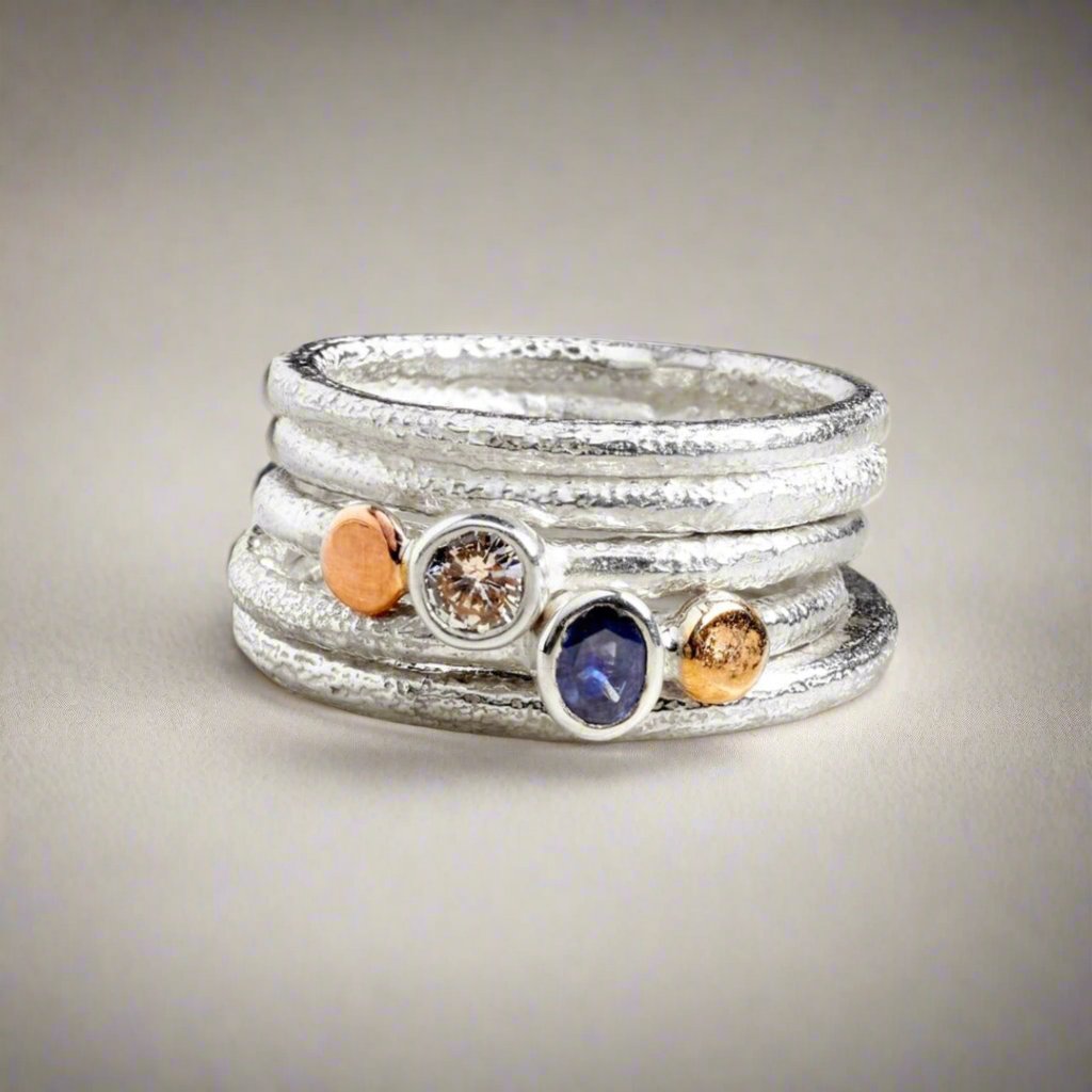 Ring stack of silver, gold, diamond and sapphire by Fi Mehra