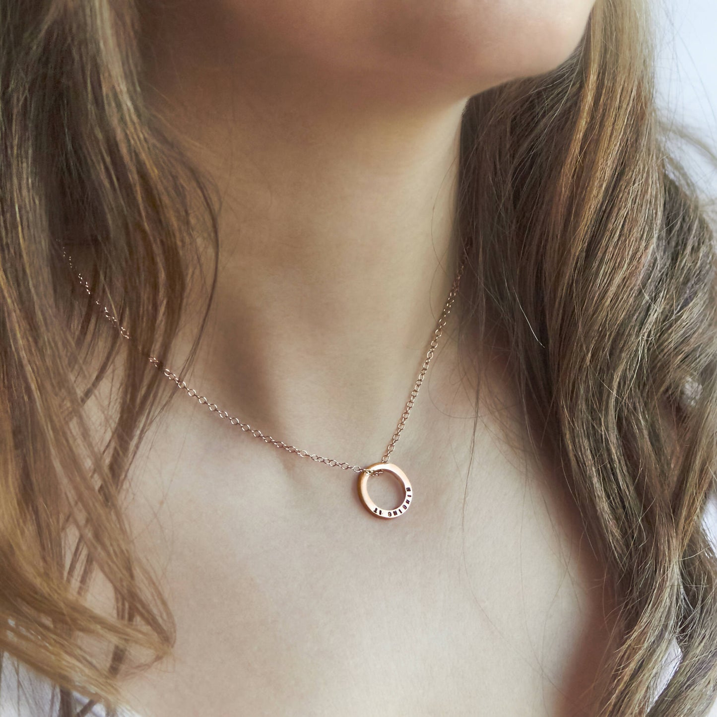 Solid Rose Gold Circle Pendant on a gold chain