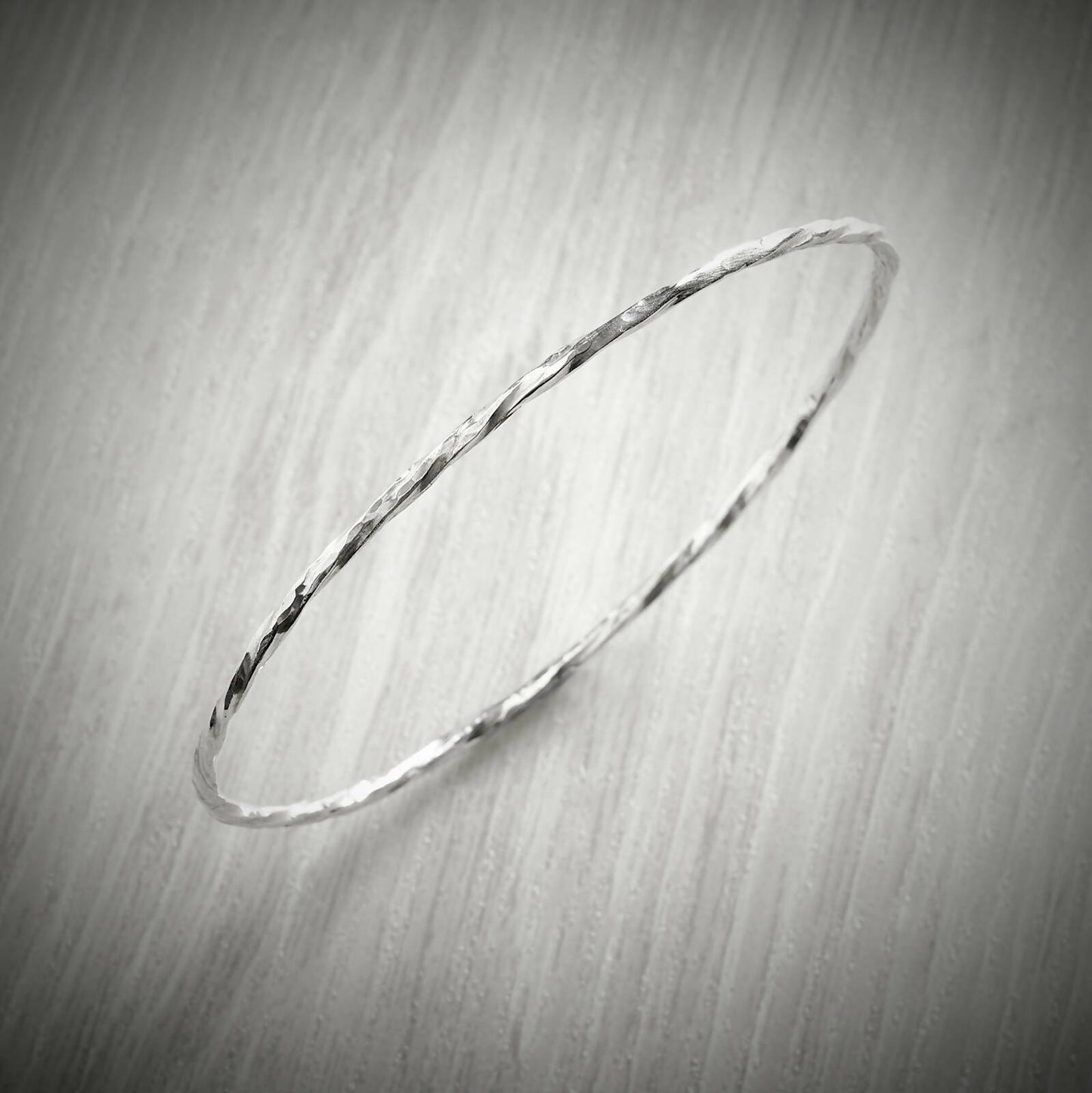 Slimline Twisted Bangle by Emma White