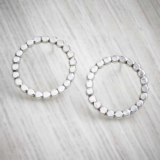 Silver handmade earrings, bobble circle studs on grey background-0