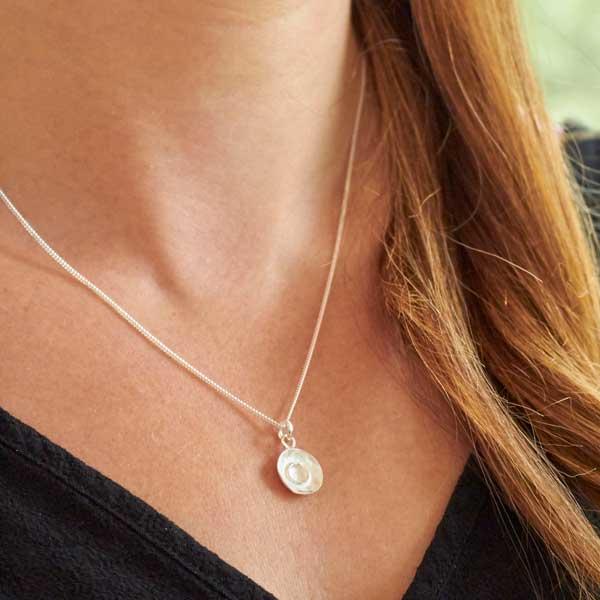 Silver dimpled dish pendant by Fi Mehra. Image property of THE JEWELLERY MAKERS.-0