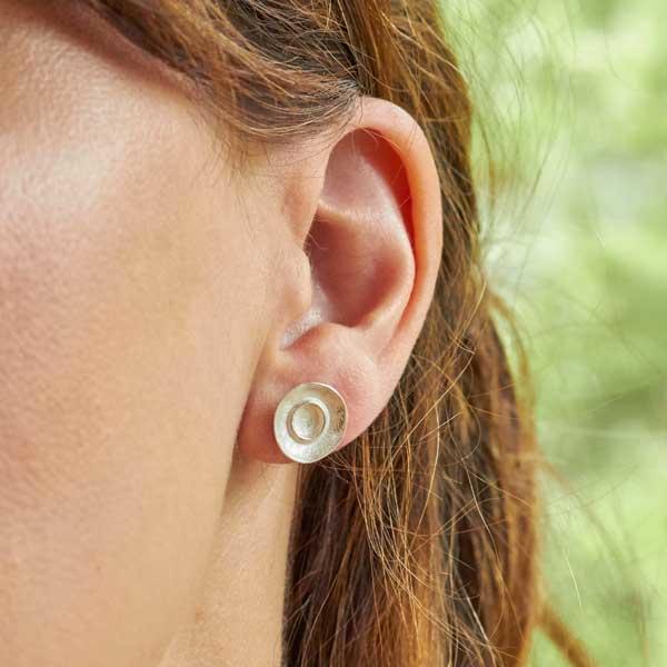 Silver dimpled dish stud earrings by Fi Mehra. Image property of THE JEWELLERY MAKERS.-2
