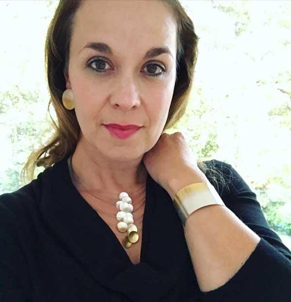 Electra Silver and Gold Wide Cuff by Melanie Hamlet. Image property of THE JEWELLERY MAKERS, worn on a woman with brown hair-1
