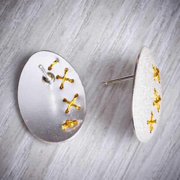 Large silver Cross-Stitched Studs by Sara Bukumunhe. Image property of THE JEWELLERY MAKER.-2