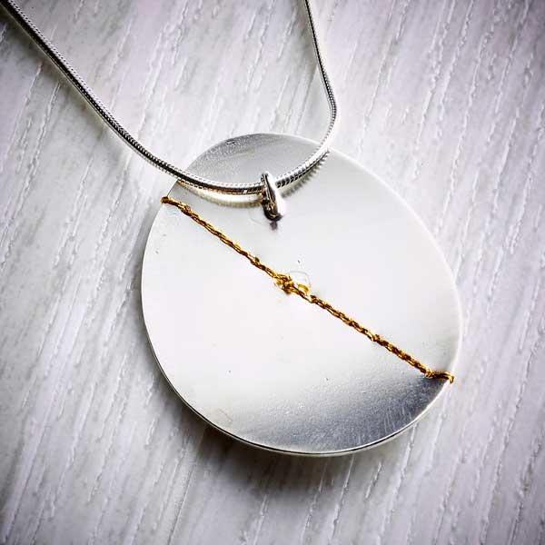 Silver and gold large oval necklace back view by Sara Buk-3