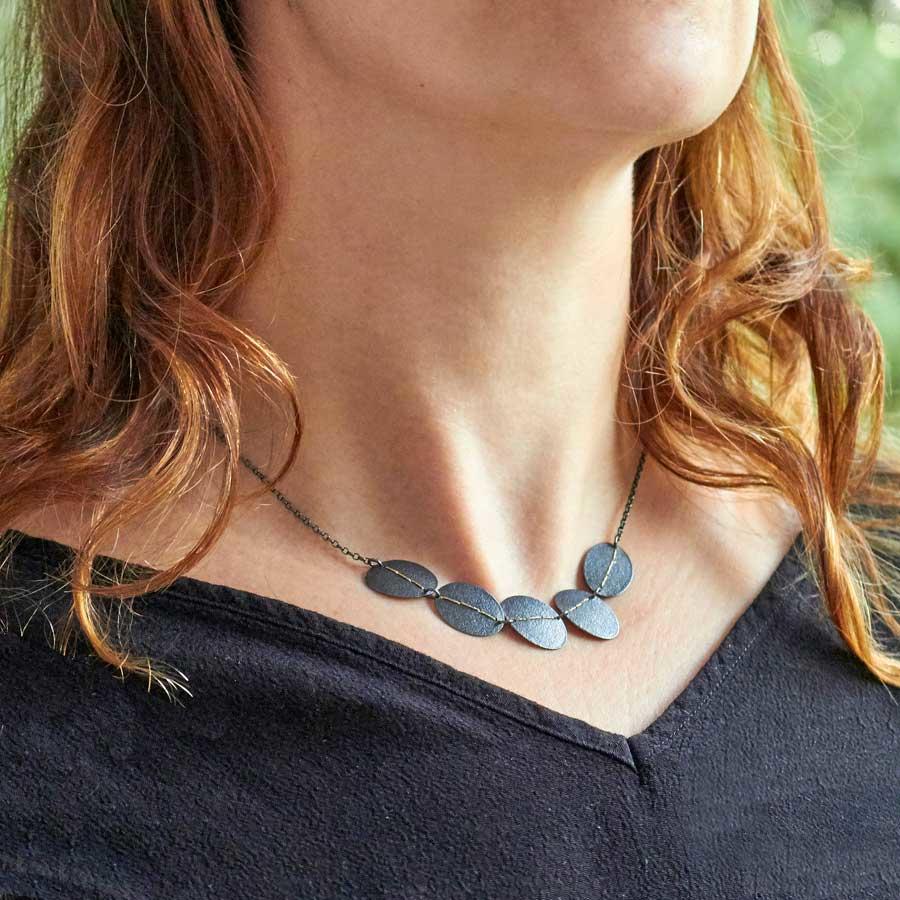 Oxidised Silver Pebbles Necklace Sewn with Gold Thread by Sara Bukumunhe-1