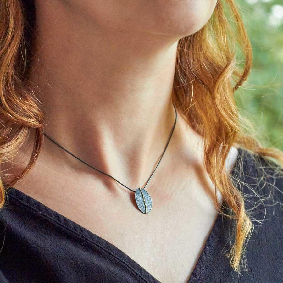 Small Oxidised Silver Oval Necklace sewn with Gold thread by Sara Bukumunhe-0