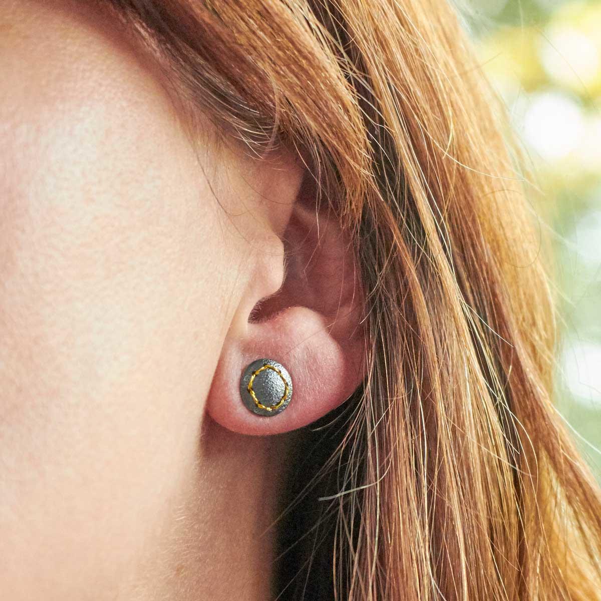 Oxidised (Blackened) Silver, Round Stud Earrings, with Gold Thread Circle by Sara Bukumunhe. Image property image of THE JEWELLERY MAKERS.-2