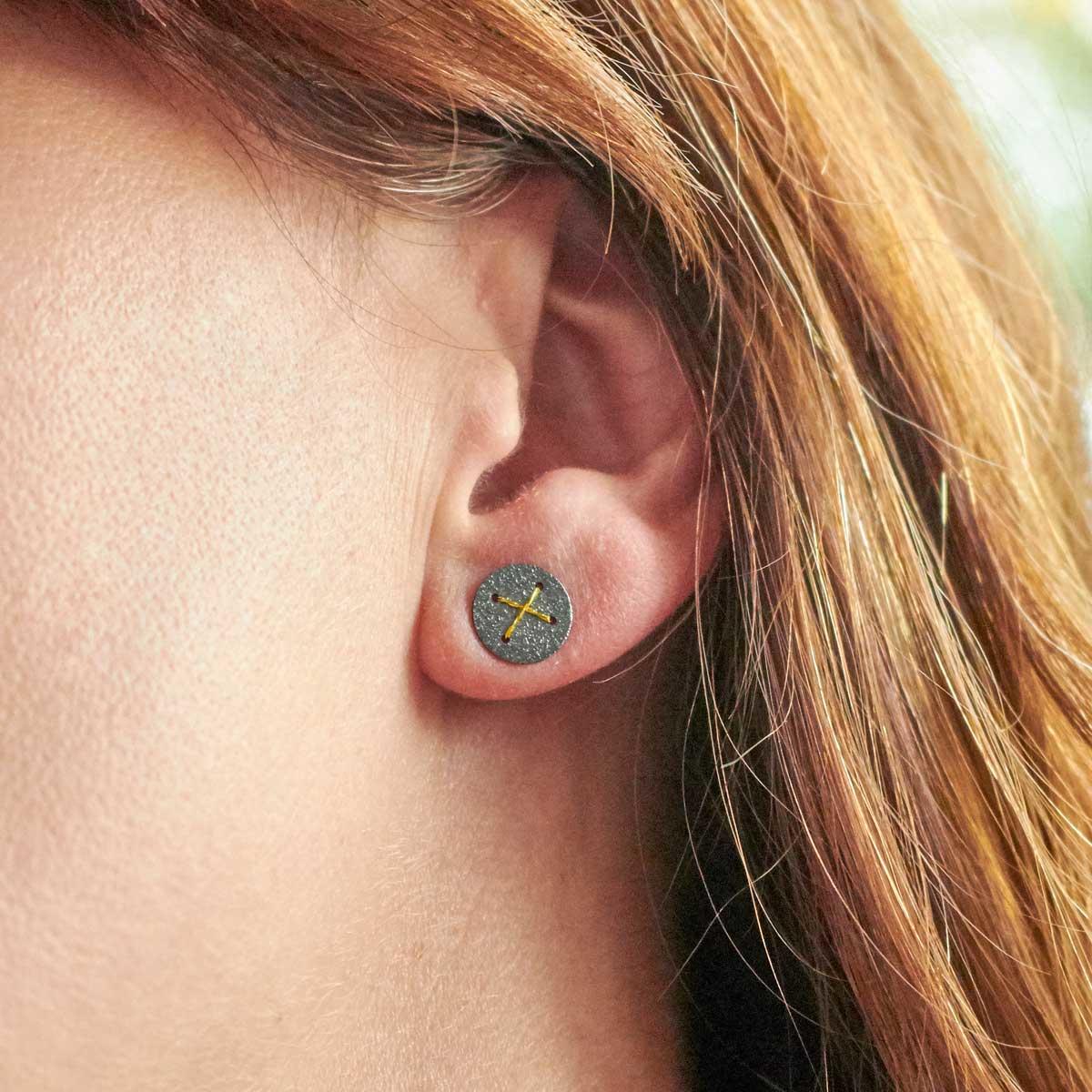 Oxidised Silver Stud Earrings with Gold Cross by Sara Bukumunhe. Image property of THE JEWELLERY MAKERS.-2
