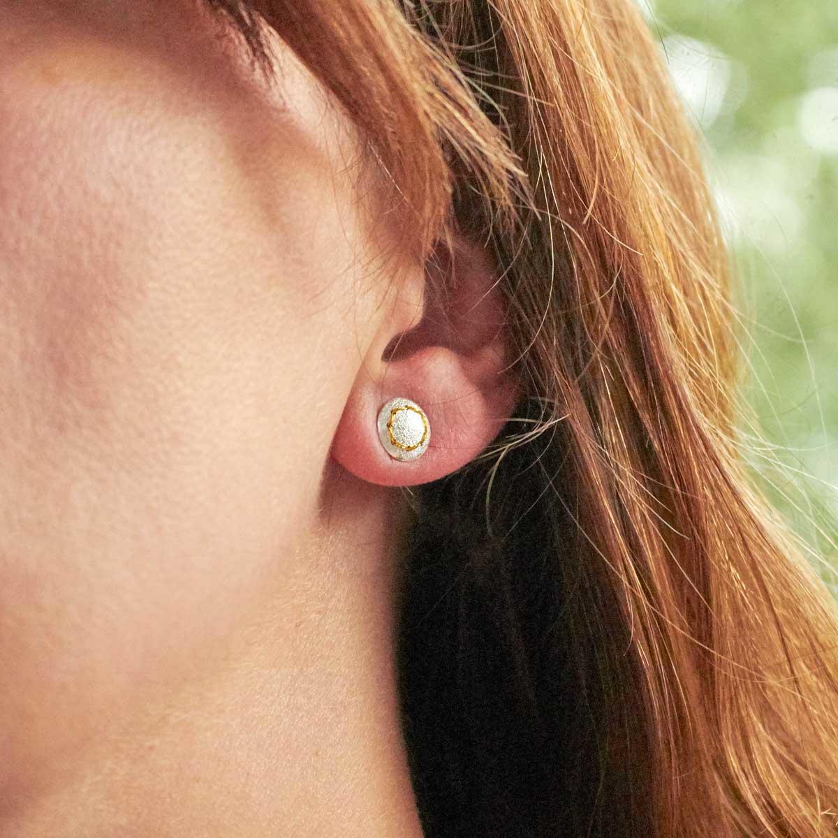 Handmade silver stud earrings sewn up with a circle of gold thread back view-1