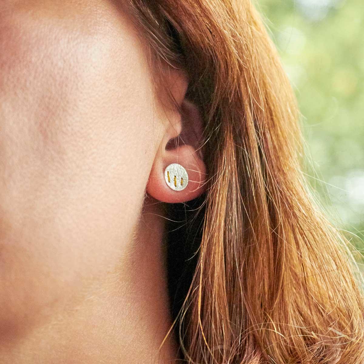 Silver Studs with 3 Gold Thread Stitches by Sara Bukumunhe. Image property of THE JEWELLERY MAKERS.-2