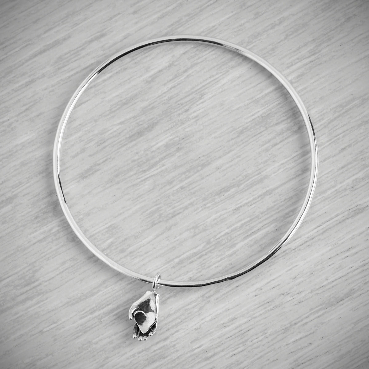 Tiny Heart in Hand Bangle by Emma White