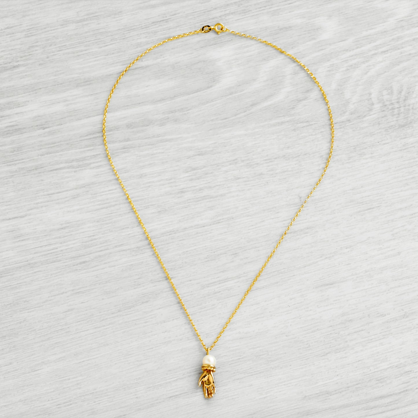 9ct Solid Gold Tiny Hand Necklace with AAA Akoya Pearl by Emma White