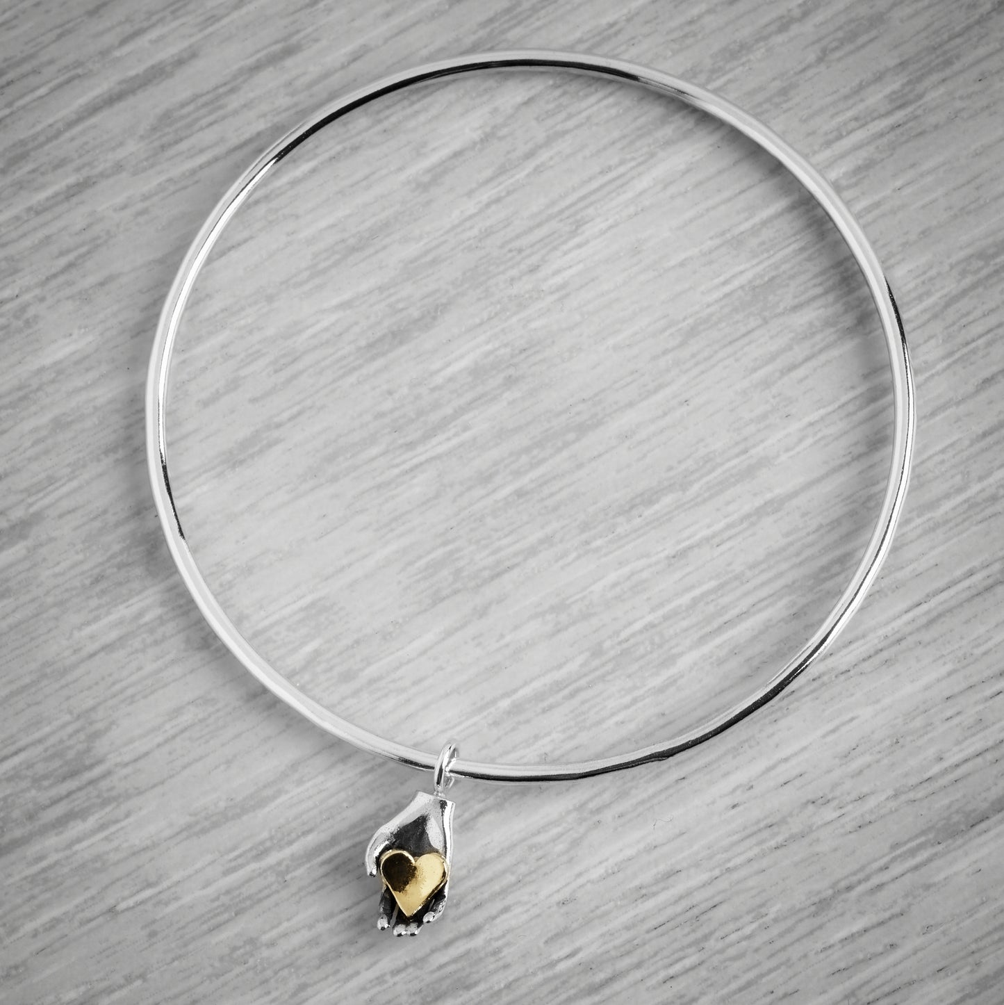 Tiny Heart in Hand Bangle by Emma White