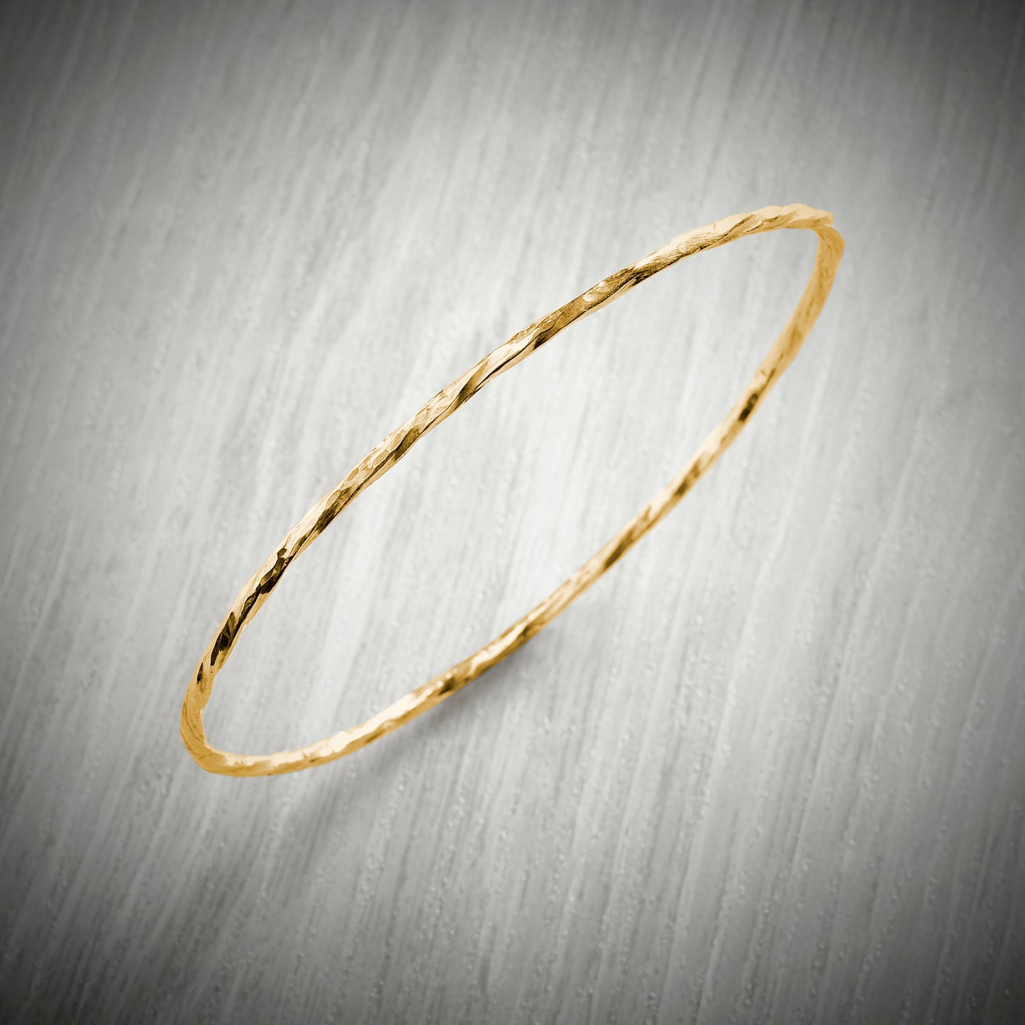 Solid Gold Slimline Twisted Bangle by Emma White