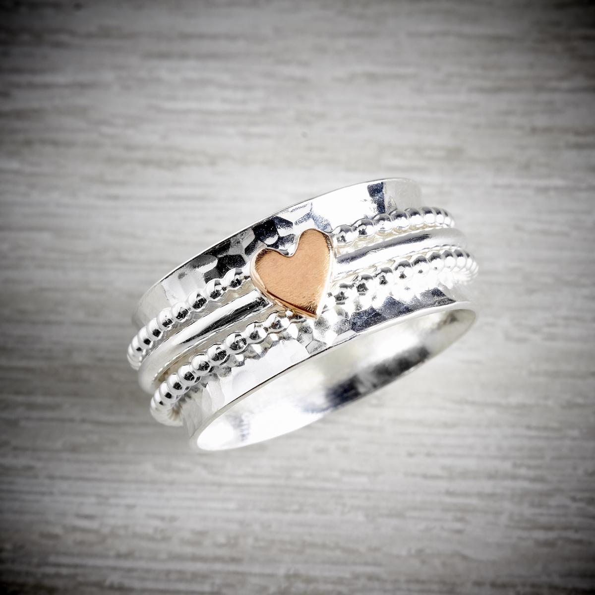 silver spinning ring with teeny tiny rose gold heart by elin mair available from the jewellery makers. IMAGE PROPERTY OF EMMA WHITE-0