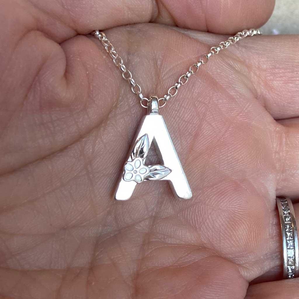 Silver Alphabet Necklace, by Elin Mair. Image property of THE JEWELLERY MAKERS in hand-2