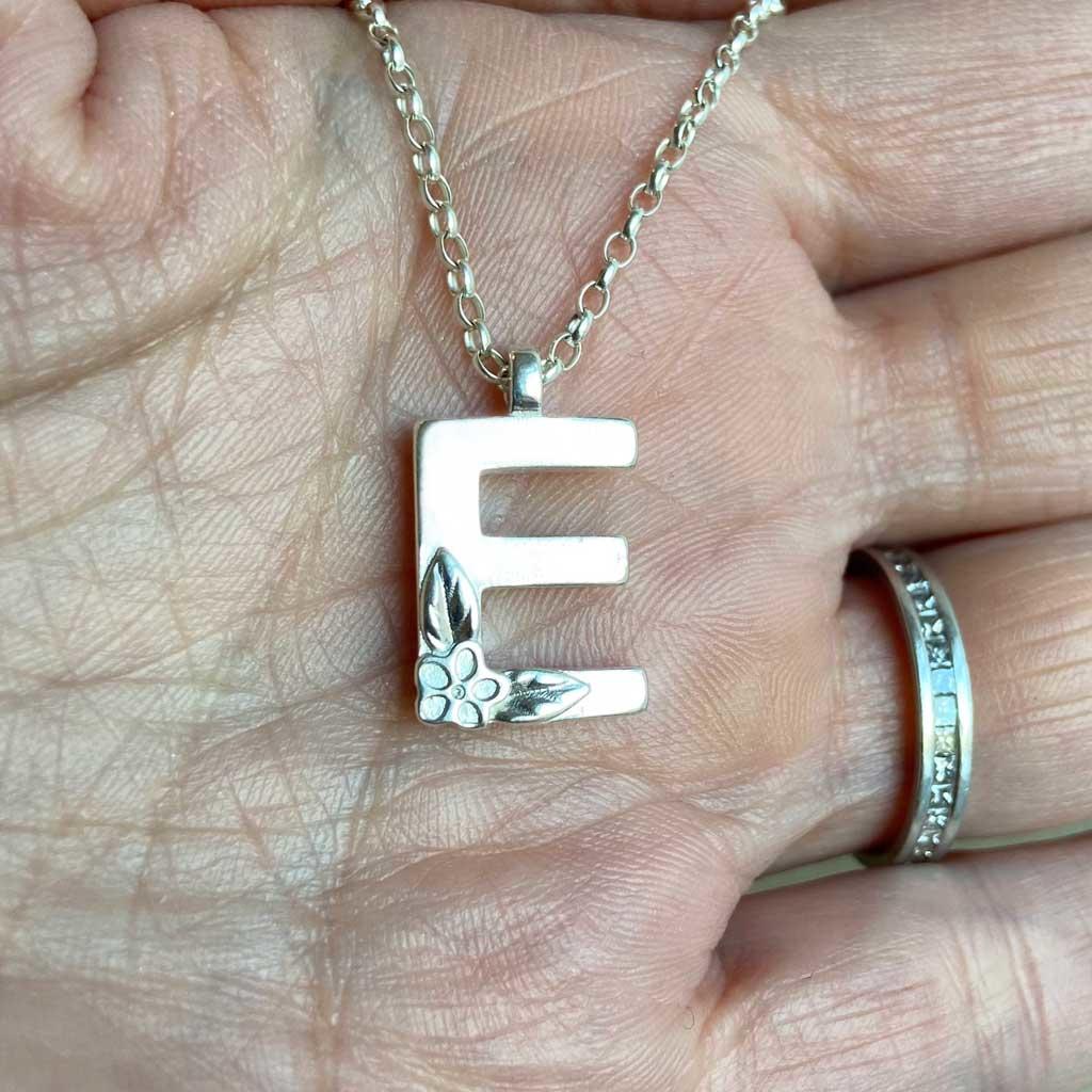 Silver Initial necklace, Letter E. Made by Elin Mair, image property of THE JEWELLERY MAKERS in hand-3
