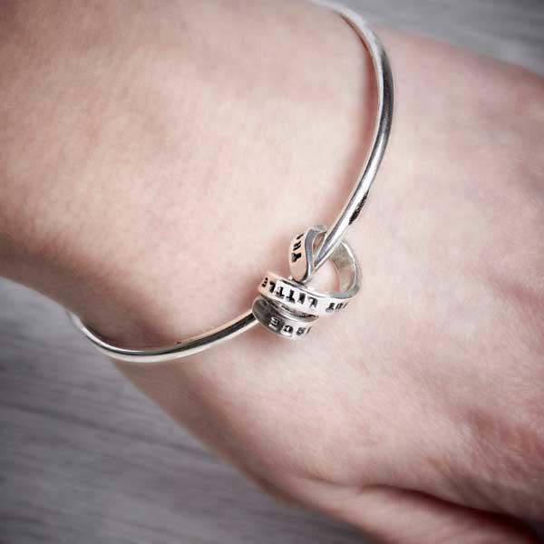 Silver Bangle with Personalised Story Spiral by Emma White, worn on.-1