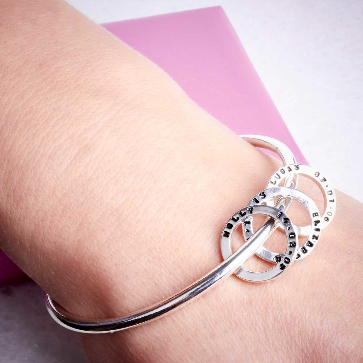 Handmade silver bangle with personalised silver beads by Emma White. Image property of THE JEWELLERY MAKERS-1