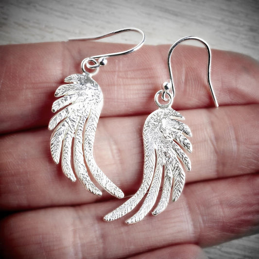 silver angel wing drop earrings  by Fi Mehra available from the jewellery makers, image property of EMMA WHITE-1