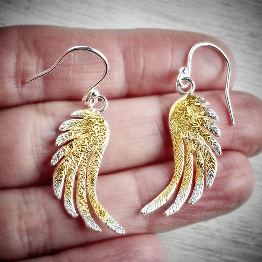 large silver and gold angel wing drop earrings by Fi Mehra, available from the jewellery makers, image property of EMMA WHITE-1