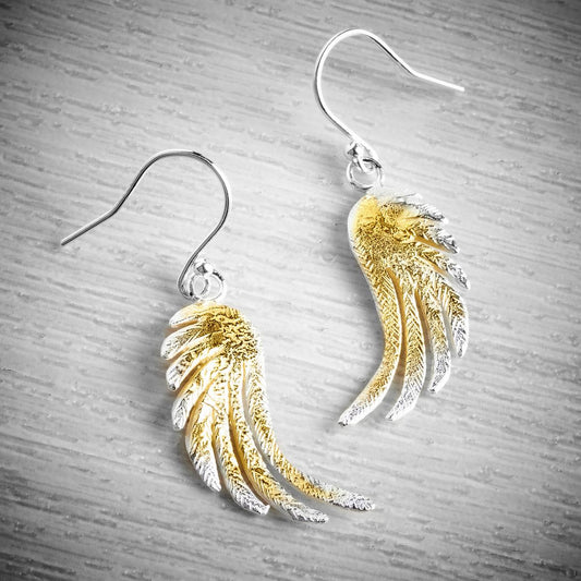 large silver and gold angel wing drop earrings by Fi Mehra, available from the jewellery makers, image property of EMMA WHITE-0