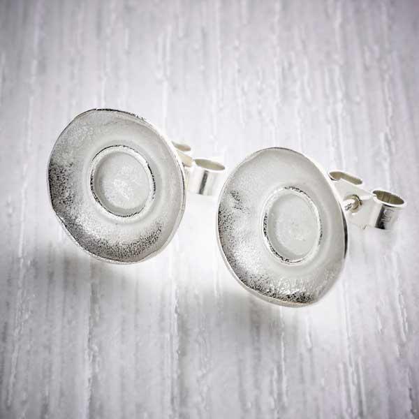Silver dimpled dish stud earrings by Fi Mehra. Image property of THE JEWELLERY MAKERS.-1