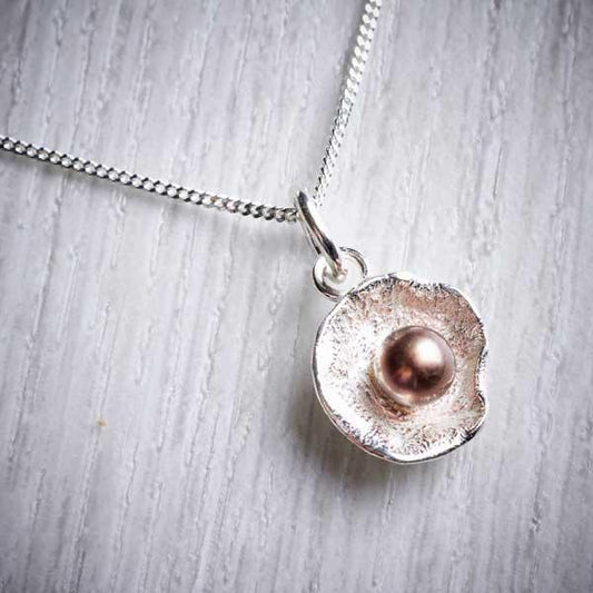 Silver Oyster Cup and Peacock Pearl Pendant by Fi Mehra. Image property of THE JEWELLERY MAKERS.-0