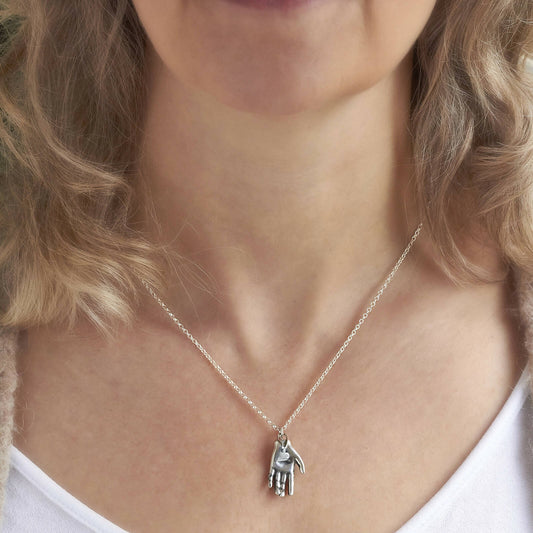 Silver Heart in Hand Necklace by Emma White