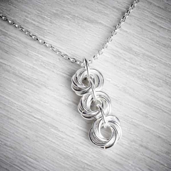 Sterling silver hot sale knot necklace