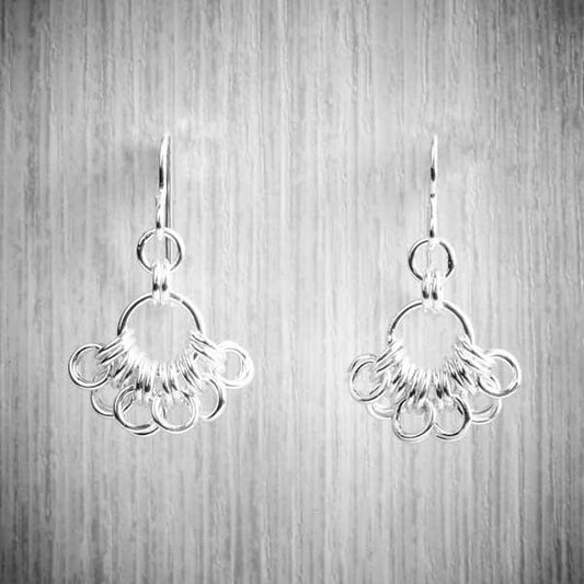 silver Chainmaille earrings in a fan shape on a grey background-0