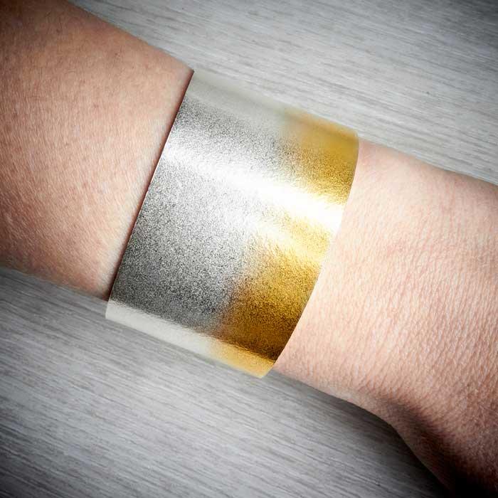 Electra Silver and Gold Wide Cuff by Melanie Hamlet. Image property of THE JEWELLERY MAKERS, worn on-2