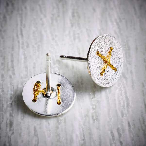 Silver Round Studs with Gold Thread Cross by Sara Bukumunhe. Image property of THE JEWELLERY MAKERS.-2