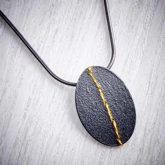 Small Oxidised Silver Oval Necklace sewn with Gold thread by Sara Bukumunhe-1