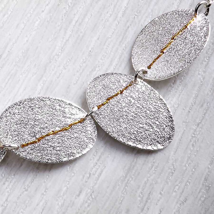 5 Silver Pebbles, A Necklace Sewn with Gold Thread by Sara Bukumunhe-1