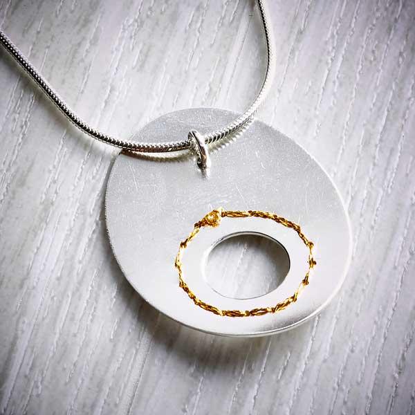 Silver Cut-out Circle Necklace sewn with Gold thread by Sara Bukumunhe-2