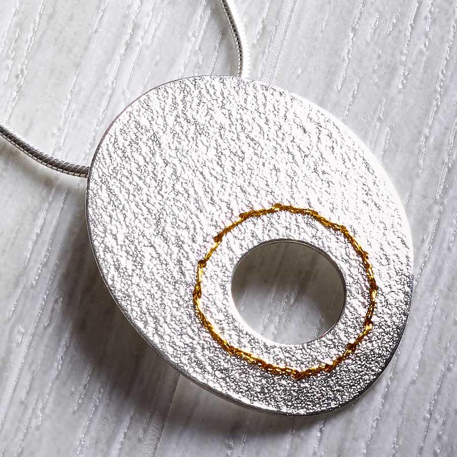 Silver Cut-out Circle Necklace sewn with Gold thread by Sara Bukumunhe-0