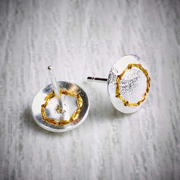 Handmade silver stud earrings sewn up with a circle of gold thread back view-2