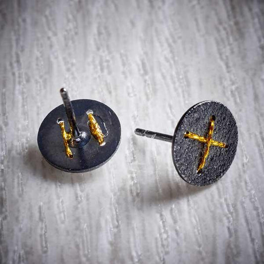Oxidised Silver Stud Earrings with Gold Cross by Sara Bukumunhe. Image property of THE JEWELLERY MAKERS.-1