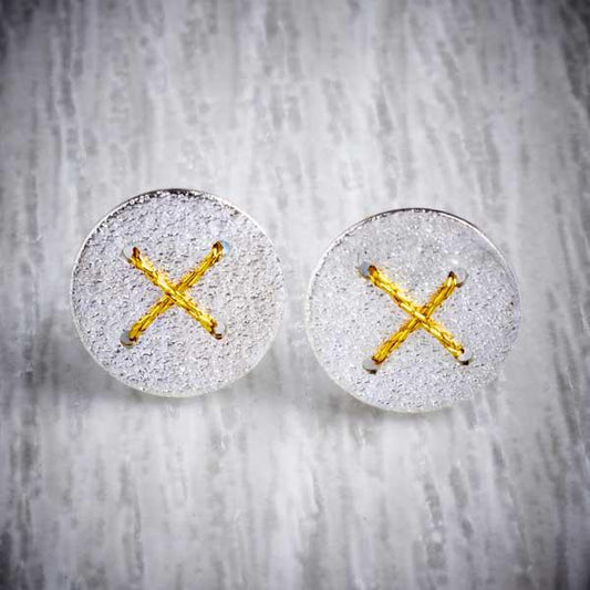 Silver Round Studs with Gold Thread Cross by Sara Bukumunhe. Image property of THE JEWELLERY MAKERS.-1