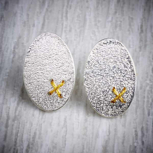 Silver Oval Studs with Tiny Gold Thread Cross Stitch by Sara Bukumunhe. Image property of THE JEWELLERY MAKERS-0