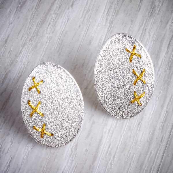 Large silver Cross-Stitched Studs by Sara Bukumunhe. Image property of THE JEWELLERY MAKER.-0